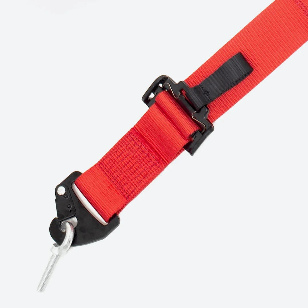 DOF Reality 4-Point Harness - close-up of adjustable lap strap with red webbing and metal adjustment hardware