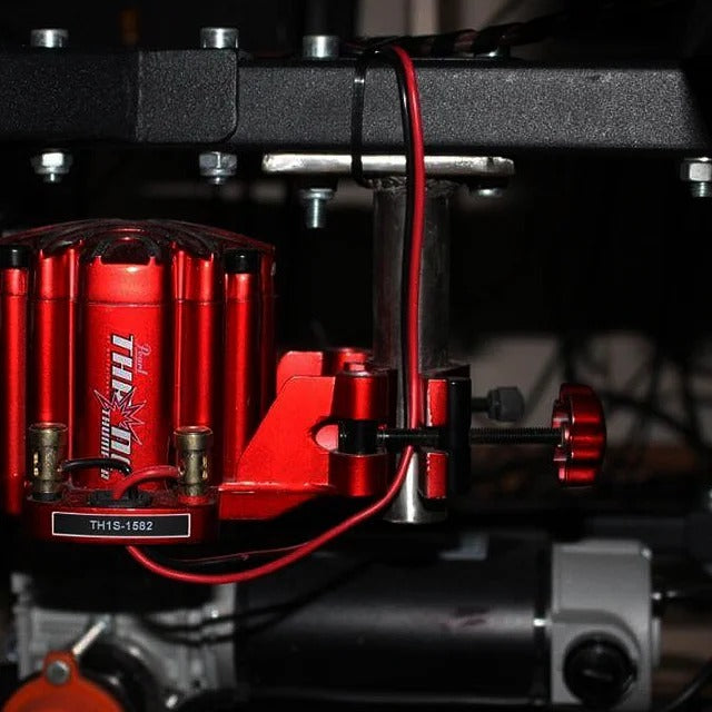 DOF Reality Buttkicker Mount - ButtKicker haptic transducer secured to DOF Reality platform frame with red wiring shown