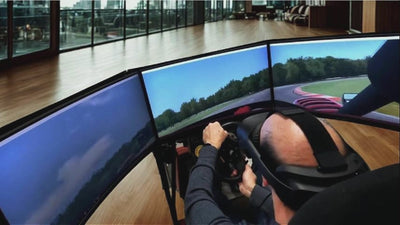 Various videos of men operating Force Dynamics racing and flight simulator on 202 and 401cr motion platforms.